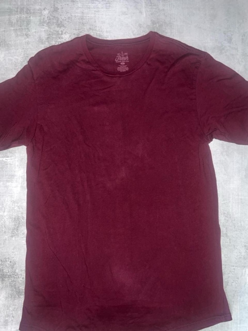 Fresh Clean Threads is a maroon crew neck t-shirt